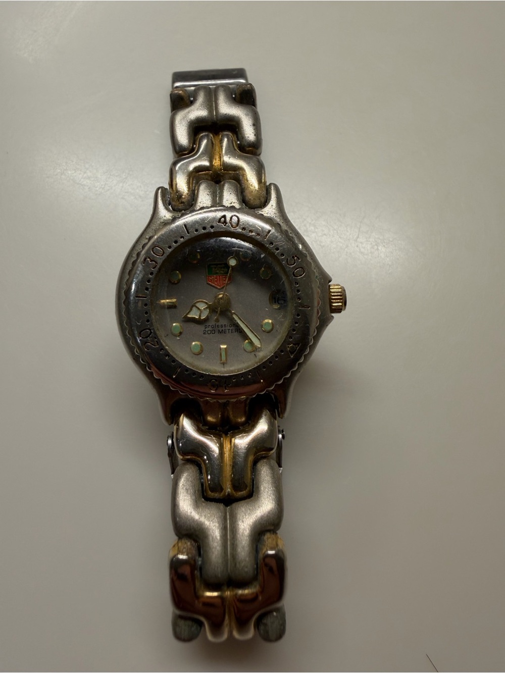Tag Heuer two-tone silver and gold women's link watch.